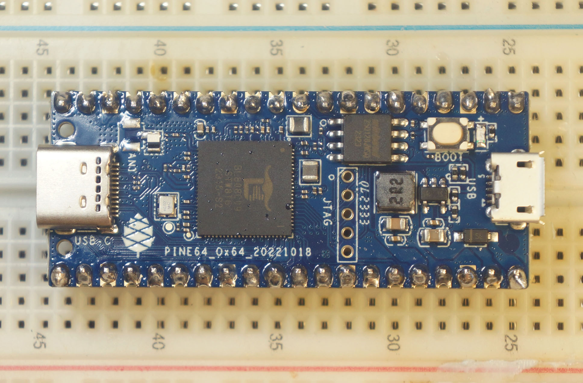 My soldering of Ox64 BL808 looks horrigible… But it boots NuttX!